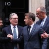 Ukrainian President Volodymyr Zelenskyy, British Prime Minister Keir Starmer, French President Emmanuel Macron and German Chancellor Friedrich Merz chat on the 10 Downing Street doorstep after a meeting in central London on Monday. 8, 2025. (Photo by Adrian DENNIS / POOL / AFP via Getty Images)