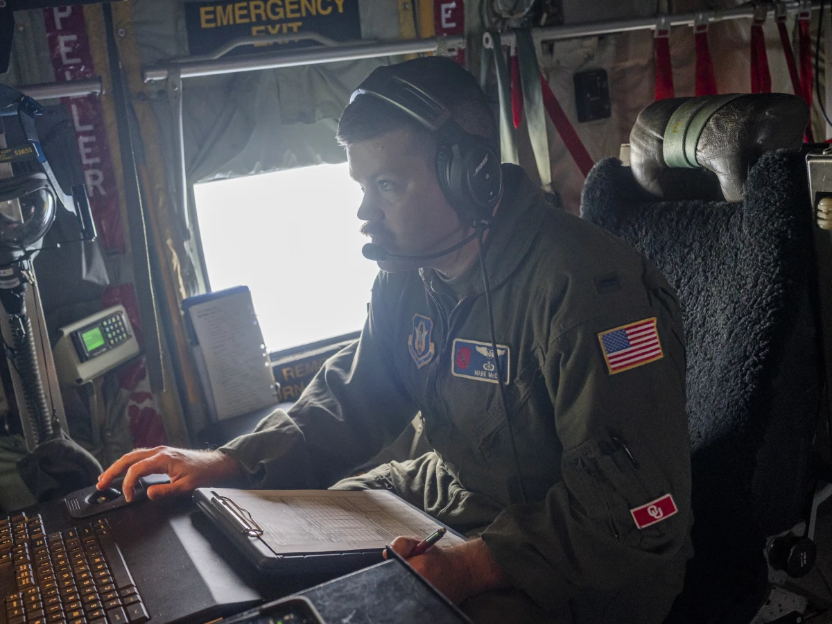 First Lt. Mark McCoy is the weather officer on board. He sends real-time data collected in-flight to the National Hurricane Center so forecasters can predict a storm's threats before landfall.