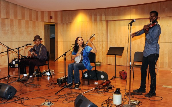 Rhiannon Giddens (center) performs with her Carolina Chocolate Drops bandmates Dom Flemons (left) and Justin Robinson at the 2010 Americana Honors & Awards nominee announcement party in Nashville, Tenn.