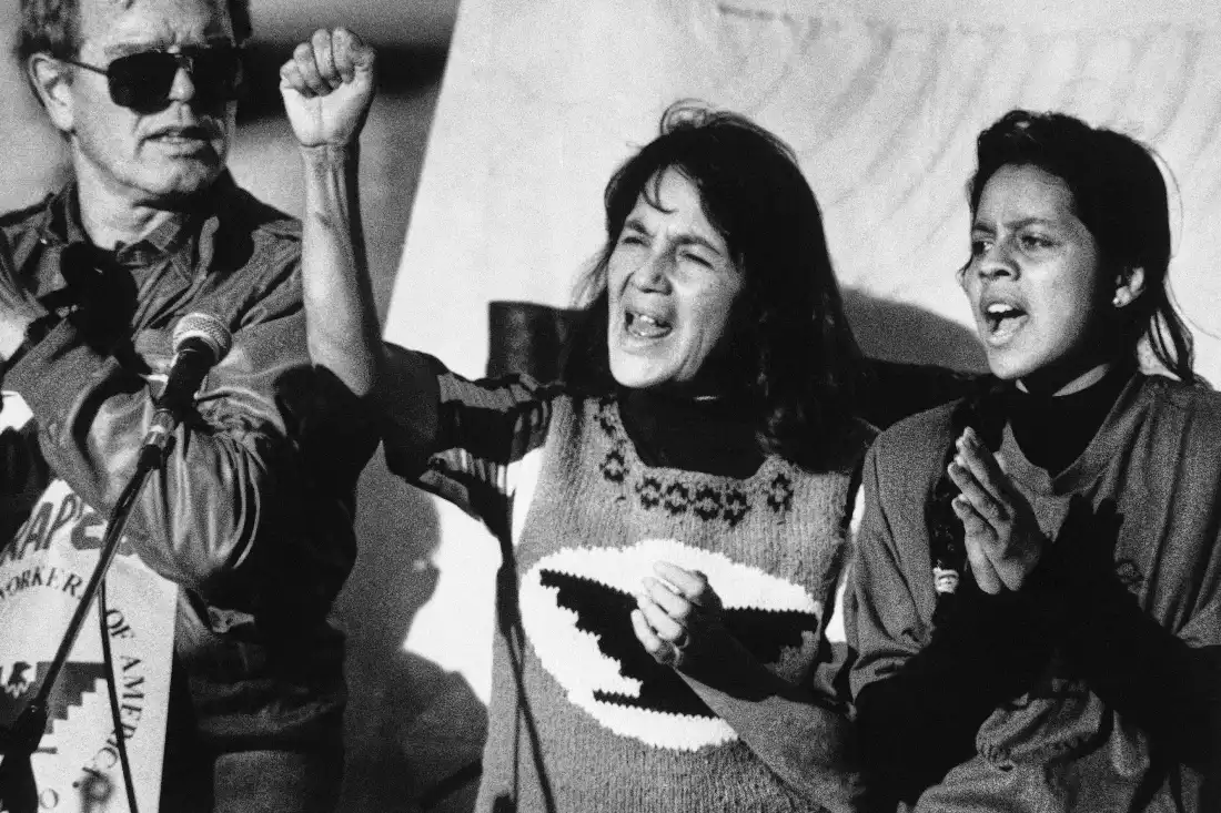 Dolores Huerta, center, leads a rally in San Francisco's Mission District on Nov. 19, 1988, along with Howard Wallace, president of the San Francisco chapter of the UFW, left, and Maria Elena Chavez, 16, the daughter of Cesar Chavez, right.