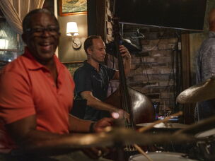 Bandleader and bassist Peter Harris (right) plays with drummer Herlin Riley (left) at Bayou Bar in New Orleans.