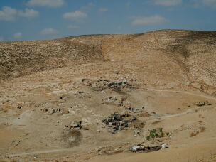 A remote Palestinian pastoral hamlet with stone dwellings and shelters nestled into the arid hills of Masafer Yatta, in the occupied West Bank, on Sept. 24, 2026.