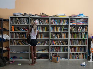 Patrons sift through goods, including books, clothing and home goods, at the New Orleans Free Store, in the Lower Ninth Ward of New Orleans.
