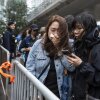 People leave the West Kowloon Magistrates' Courts in Hong Kong Tuesday, Nov. 19, 2025, following the sentencing in national security case. (AP Photo/Chan Long Hei)