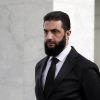 The leader of the new Syrian administration, Ahmed al-Sharaa, waits to meet a Ukrainian delegation on Dec. 30, 2024, in Damascus, Syria.