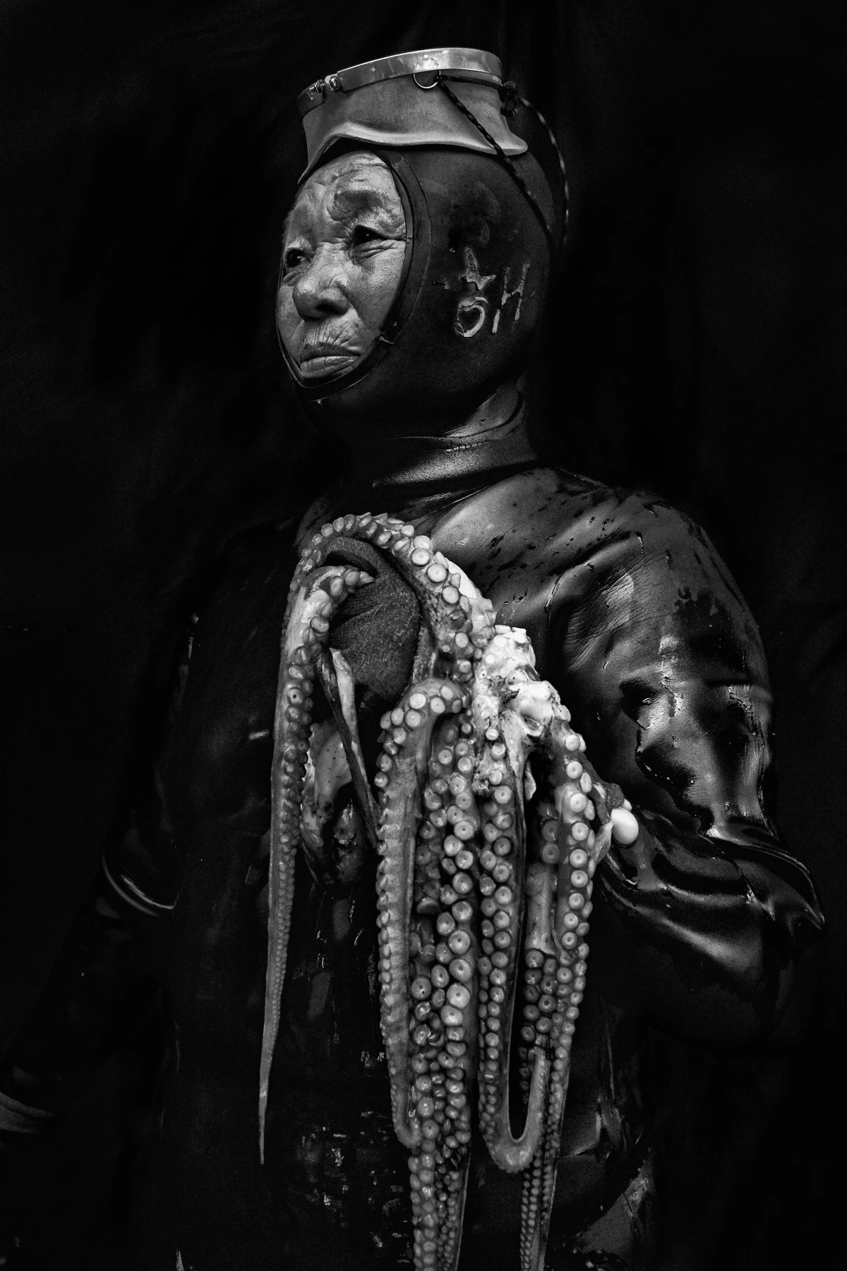 Soon-ja Hong, 69, is one of the female divers of Jeju Island, South Korea. The women are known as the Haenyeo — 'women of the sea.' Starting in the 17th century, the island's women took over the breadwinning task of deep-diving to the ocean floor. There they gather mollusks, conch, seaweed and other seafood, poviding food and income for their families and their communities. The custom was to start training from an early age. In today's industrialized agricultural world, though, the number of Haenyeo has steadily declined from tens of thousands to just a few thousand, and most of those who remain are in their 60s or older.