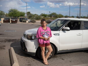 Tara Gentner stands next to the car she inherited from her mother, Sheri Petty. Petty died last summer after exposure to extreme heat. Gentner found her mother passed out on the floor of their manufactured home in sweltering July temperatures.