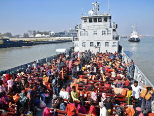 Rohingya refugees are seen on a Bangladesh's Navy ship as they are being relocated to Bhashan Char Island in the Bay of Bengal, in Chittagong on January 29, 2021.