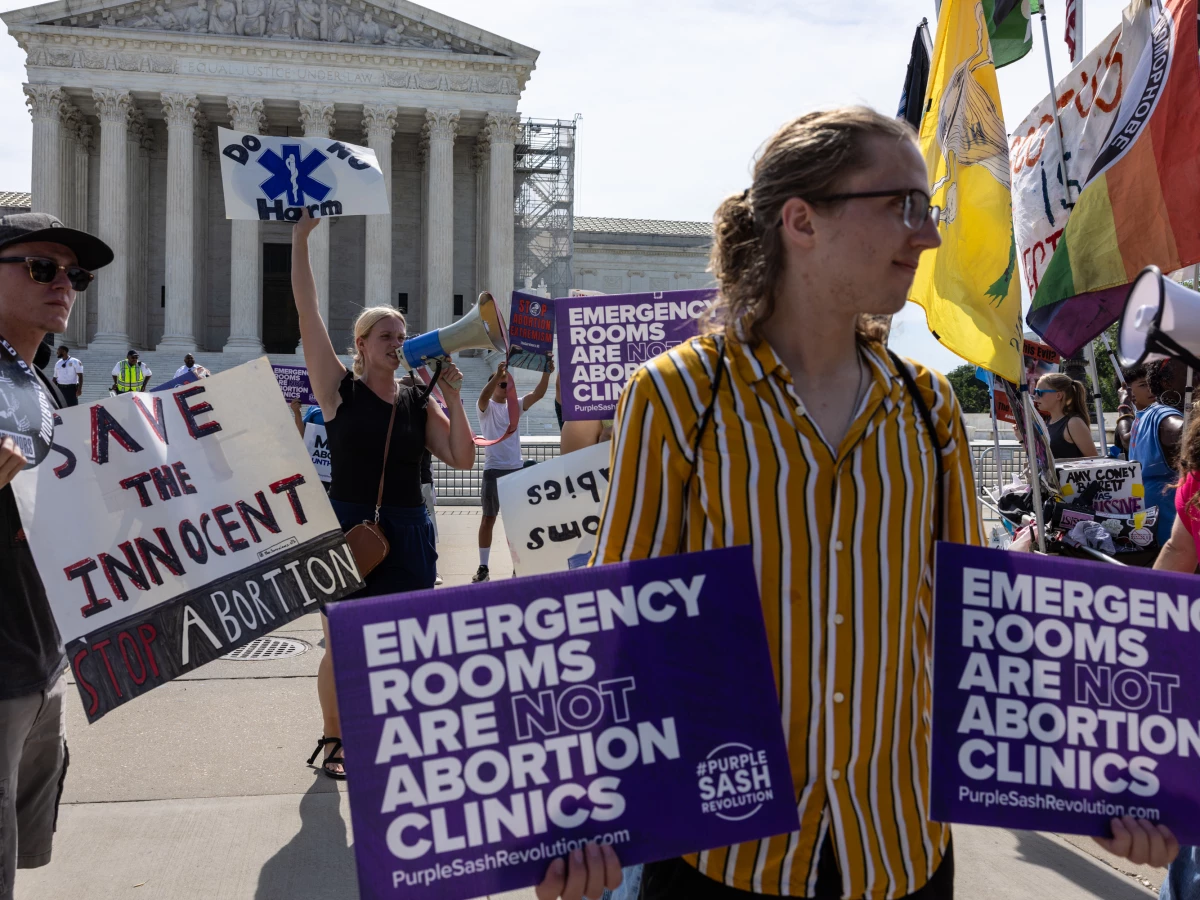 Anti-abortion demonstrators gather in front of the Supreme Court on Wednesday, the day a copy of the Idaho ruling was accidentally posted to the court's website.