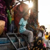 A Sudanese girl who has fled from the war with her family arrives at a refugee transit center. The conflict that began in April 2023 has displaced millions and created a humanitarian crisis.