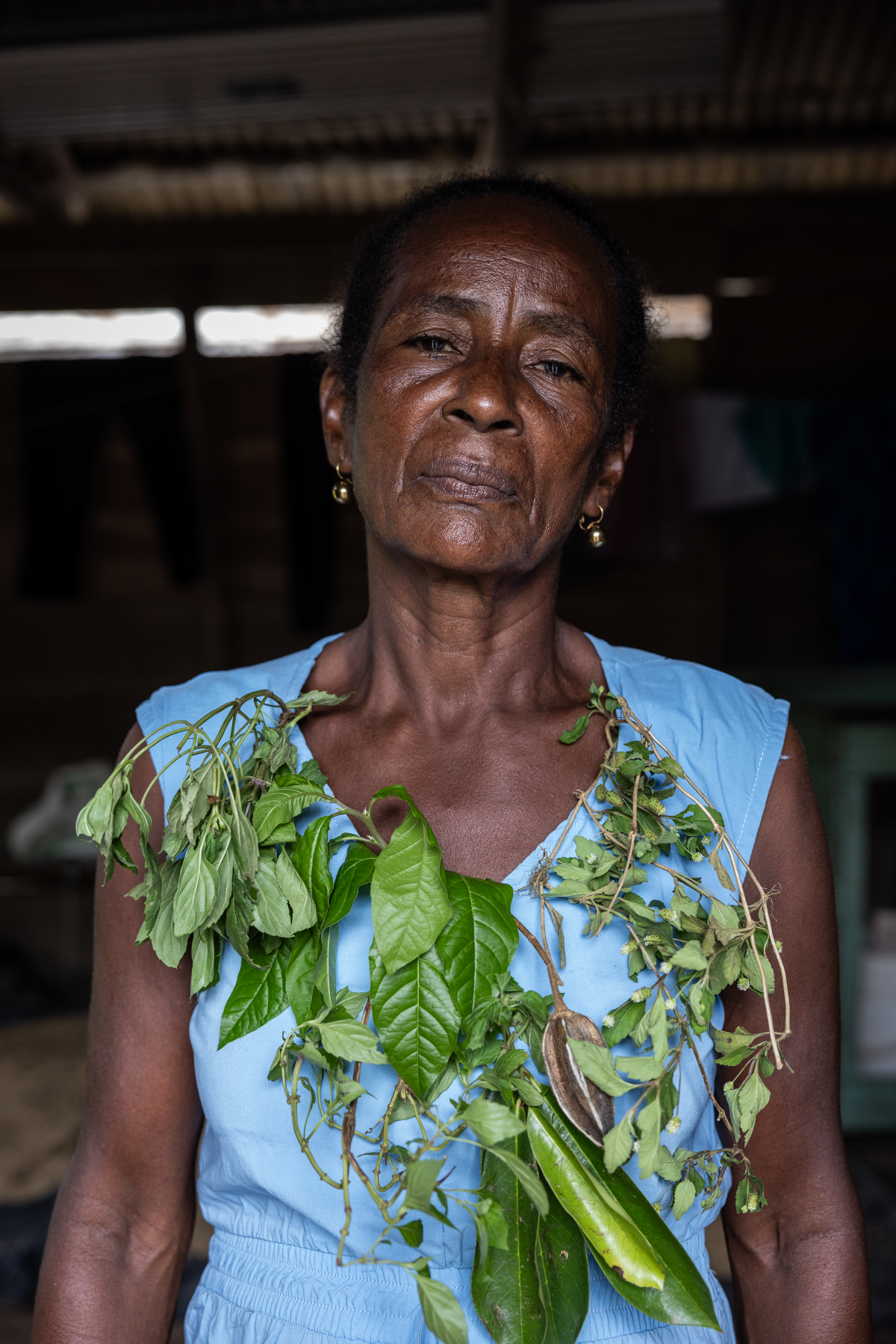 'I cure the 'evil eye,' the evil of the nation,' says Margarita Rojas Mena, a healer and herbalist. 'When there are wounds, I use my herbs, and sometimes I've had to do sutures.' Here she is wearing a wreath composed of the leaves of the totumo plant, used traditionally to reduce pain from cramps and from childbirth.
