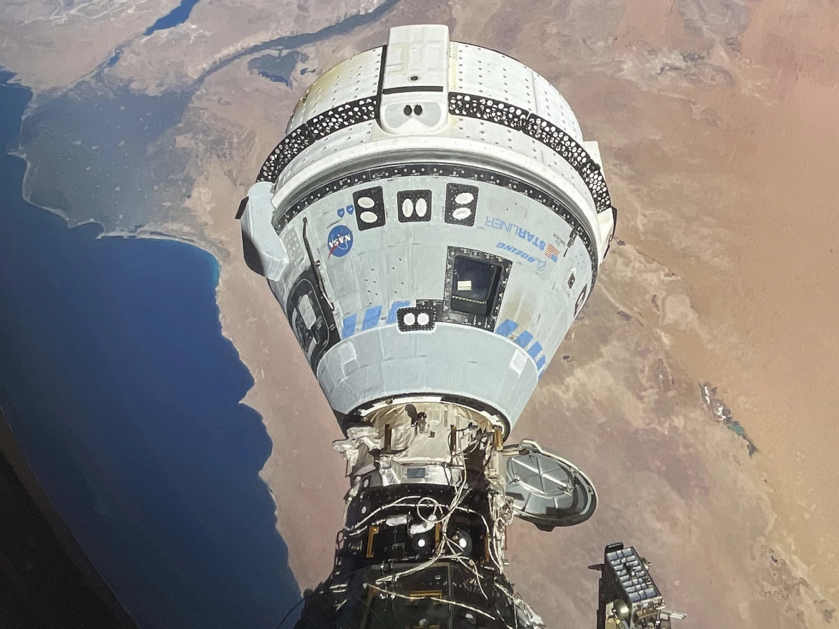 The Starliner spacecraft docked with the International Space Station and orbiting 262 miles above Egypt's Mediterranean coast on June 13. NASA says additional testing is needed before Starliner can return to Earth.