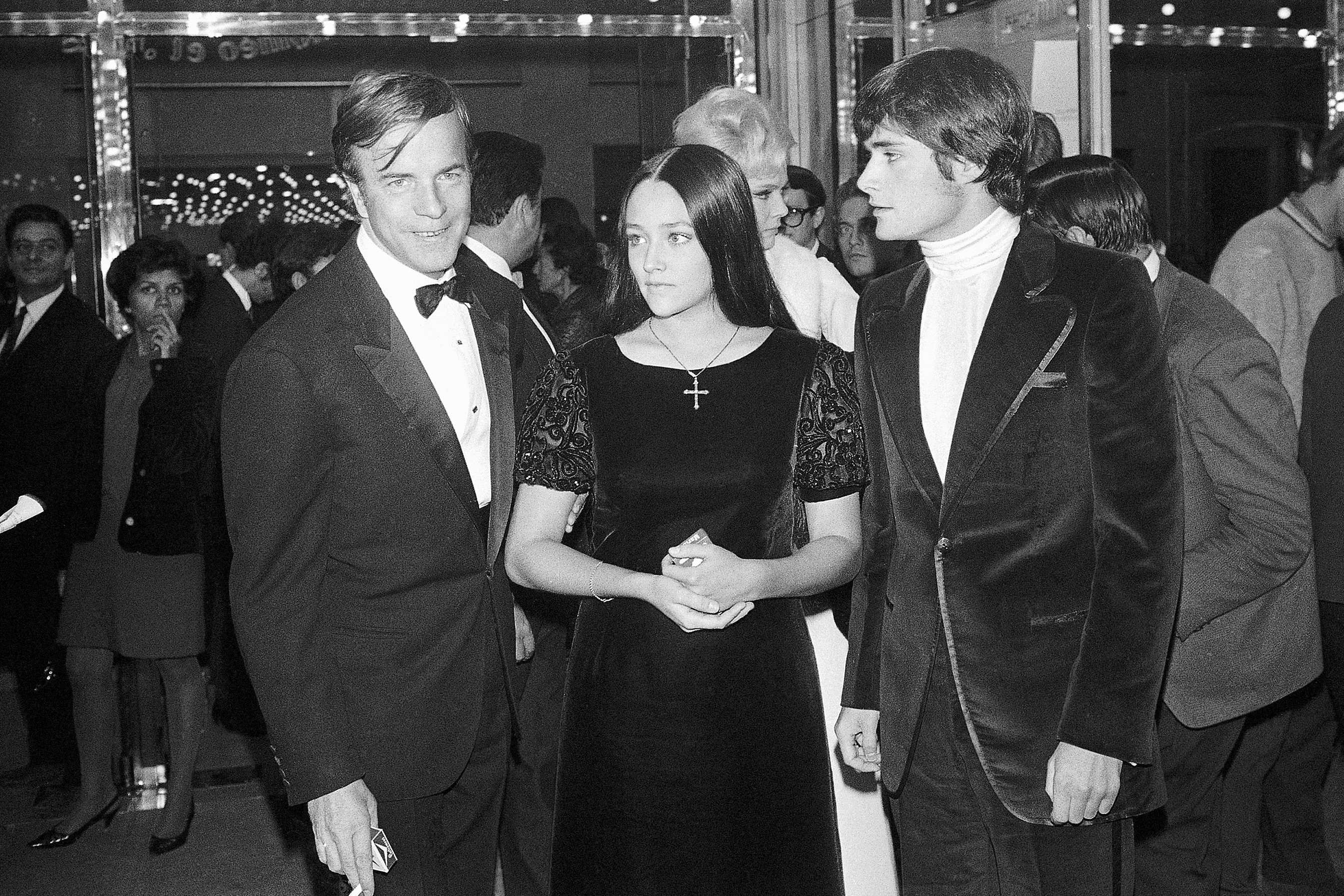 "Romeo and Juliette" movie director Franco Zeffirelli (from left), actors Olivia Hussey and Leonard Whiting are seen after the Parisian premiere of the film in Paris on Sept. 25, 1968.