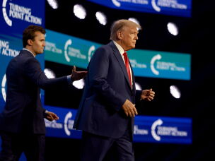 Donald Trump walks onstage after being introduced by Charlie Kirk at the Turning Point Action conference on July 15, 2023, in West Palm Beach. Before his death, Kirk was a key conduit between young conservatives and Trump's White House.