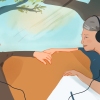 An elderly couple sitting together listening to music on headphones. 