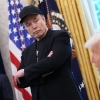 Elon Musk listens as President Trump speaks to reporters in the Oval Office in May.