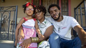 Dre'Shean Napoleon, right, sits with his mother, Nikkisha Napoleon and niece, Symphony Bradford at the home where Nikkisha Napoleon grew up in the Lower 9th Ward of New Orleans on July 5, 2025.