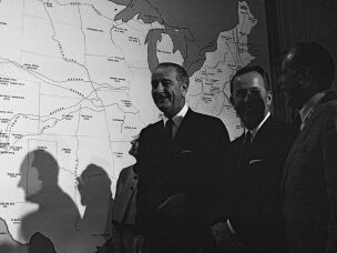 President Lyndon Johnson stands near a map of the U.S. after signing several conservation bills into law in 1968. He signed the landmark National Historic Preservation Act two years earlier.