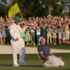 Rory McIlroy of Northern Ireland (R) celebrates winning with caddie Harry Diamond (L) after the playoff hole during the final round of the 2025 Masters Tournament at Augusta National Golf Club on April 13 in Augusta, Ga.