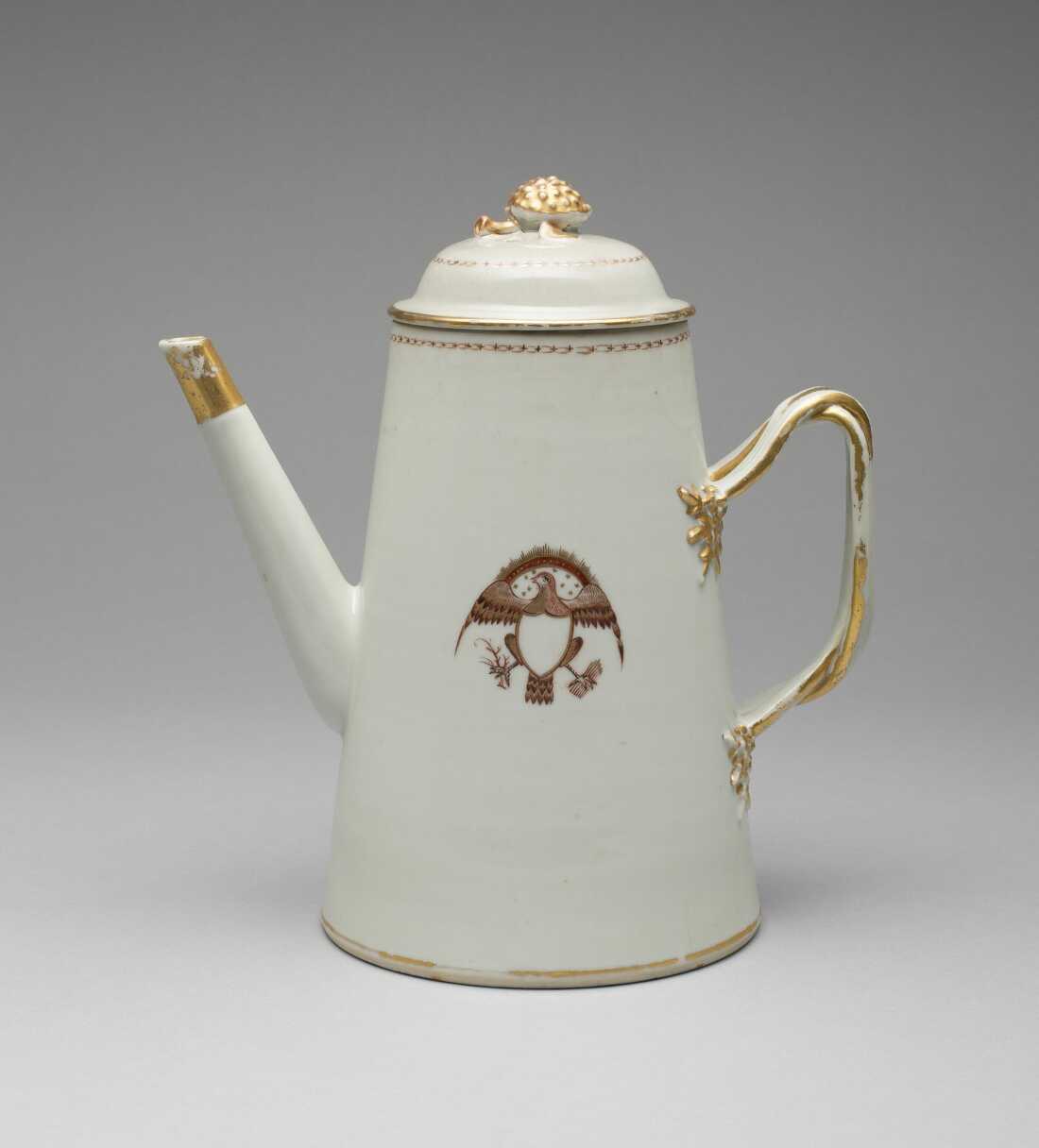 A white and gold coffeepot with cover, circa 1795. It has an American eagle motif, made in China for the American market. Coffee was part of a growing trend of globalization in the colonial era.