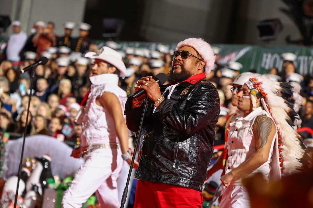 Victor Willis (center), the only surviving original member of Village People, performs during the 91st anniversary of the Hollywood Christmas Parade.