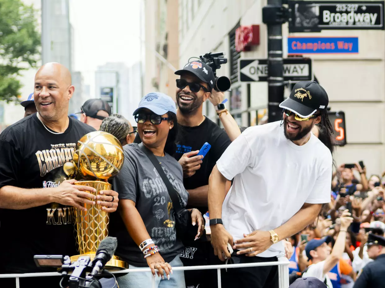 Rick Brunson and Jalen Brunson of The New York Knicks celebrate winning the 2026 NBA Championship with a ticker tape parade at City Hall.