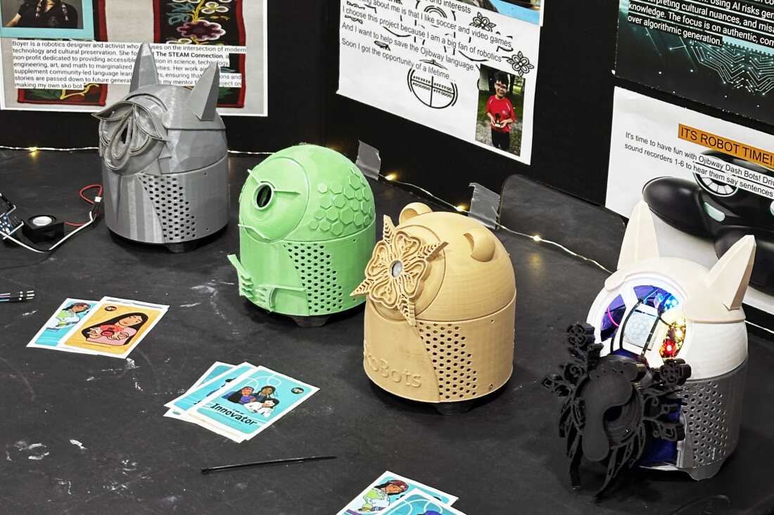 Hoy’s Sabe, or Bigfoot, SkoBot on display (right), alongside three other SkoBots that Boyer brought with her to show off at the STEAM Museum. Each represents a specific animal, such as the wolf, turtle and bear. Hoy’s SkoBot is 3D printed in light grey, and its face is adorned with a footprint surrounded by floral designs.