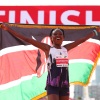 Ruth Chepngetich of Kenya celebrates after crossing the finish line to win the 2024 Chicago Marathon with a new world record time of 2:09:56 at Grant Park in Chicago on Sunday.