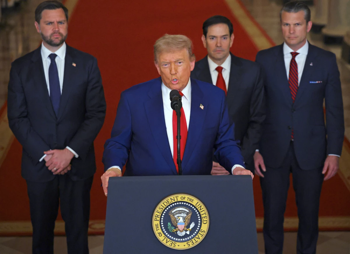 President Trump addresses the nation, alongside (from left) Vice President Vance, Secretary of State Marco Rubio and Secretary of Defense Pete Hegseth, from the White House on Saturday.