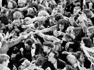 A crowd surges forward as Jimmy Carter shakes hands following a political rally in San Francisco on Oct. 31, 1976.