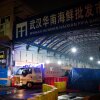Members of the Wuhan Hygiene Emergency Response Team leave the shuttered Huanan Seafood Wholesale Market in the city of Wuhan, in Hubei, Province on January 11, 2020. Investigations of the origin of COVID-19 have focused on the animals sold at the market.