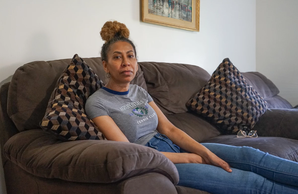 Debra Ragoonanan, a nursing assistant, says she has endured PTSD after COVID killed dozens in 2020 at the Massachusetts veterans facility where she still works. The state agreed to a $56 million settlement for veterans and their families, but caretakers have gotten little assistance.