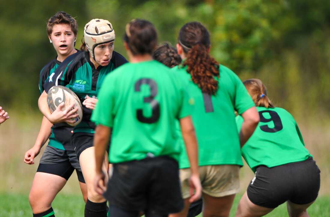 The author, Amy Morgan (in scrum cap), bashes into the defense with Frederick Women’s Rugby Club in September 2011.