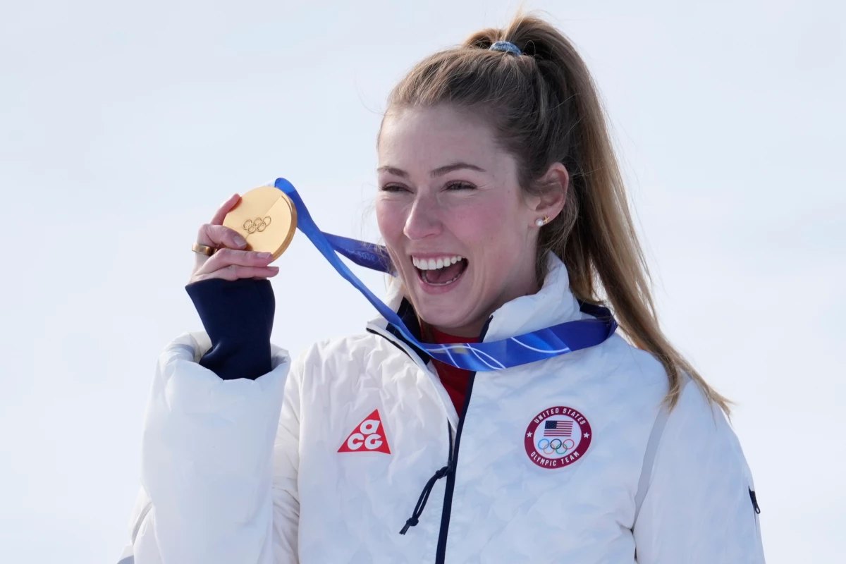 Mikaela Shiffrin from Colorado shows her gold medal of the alpine ski, women's slalom race, at the 2026 Winter Olympics, in Cortina d'Ampezzo, Italy, on Wednesday.
