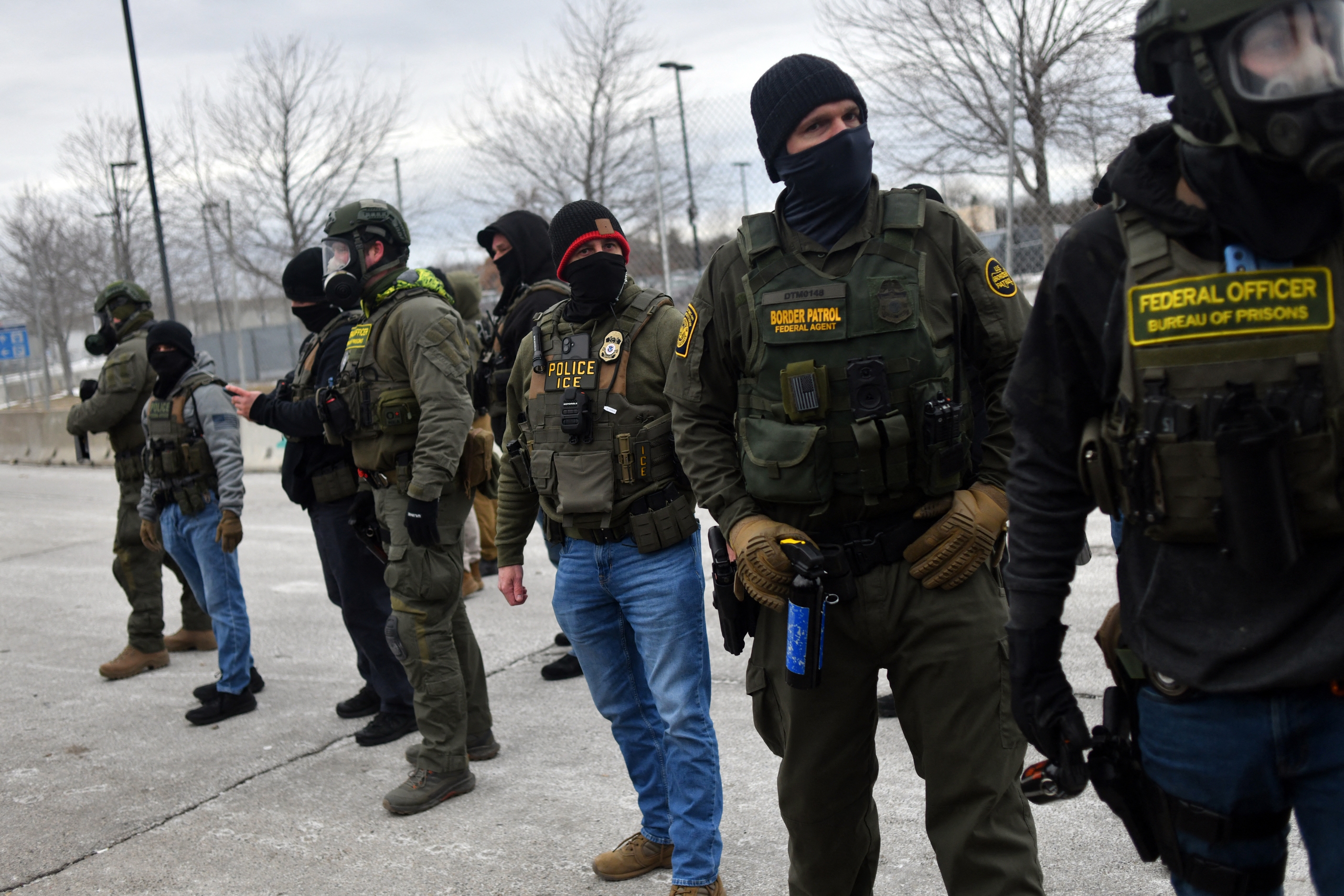 Federal law enforcement agents confront protesters during a demonstration outside the Bishop Whipple Federal Building in Minneapolis, Minnesota, on Thursday.