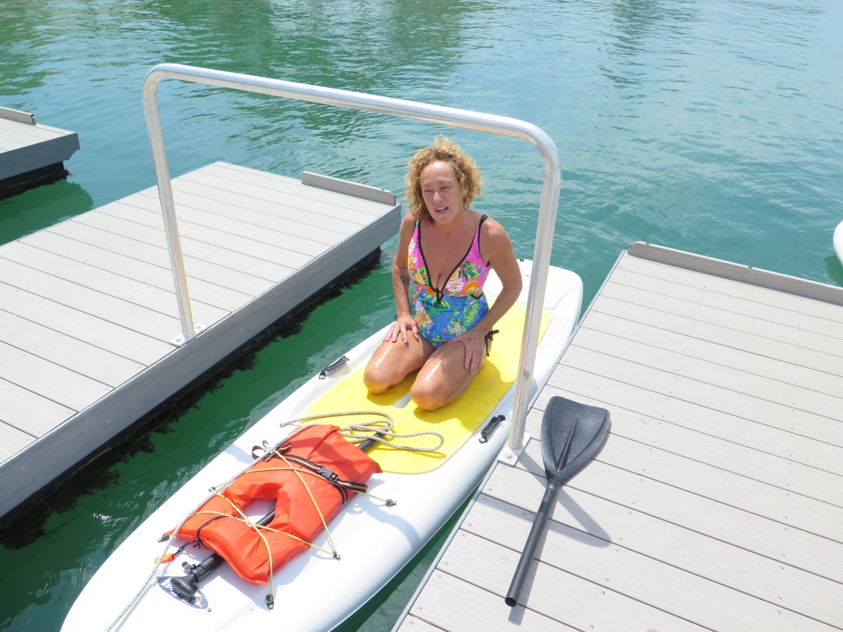 Live-aboard boater Barbie Wynn can't leave her paddleboard at a city-owned boat launch for more than 20 minutes without facing a possible $1000 fine.