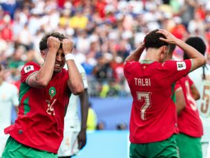 Morocco's midfielder Neil El Aynaoui (left) reacts to a missed chance during the World Cup match against France.