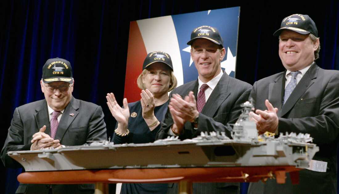 Former Vice President Dick Cheney and three children of former U.S. President Gerald Ford stand next to a model of the future aircraft carrier during a naming ceremony at the Pentagon in 2007.