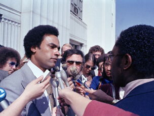 In this March 7, 1979 file photo, former Black Panther leader Huey Newton speaks to reporters outside the courthouse in Oakland, Calif.