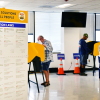 People vote in Norwalk, Calif., during early voting in California's primary election on June 1, 2026. The Department of Justice has charged 28 green card holders in the state for allegedly illegally registering to vote or voting in U.S. elections, in an escalation of a feud with California officials over the state’s voting system.