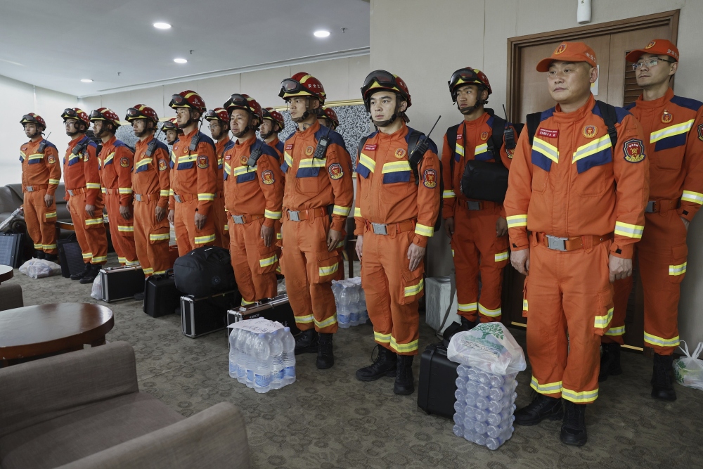 In this photo released by Xinhua News Agency, Chinese rescuers arrive at the Yangon International Airport in Yangon, Myanmar on Saturday, March 29, 2025. (Xinhua)