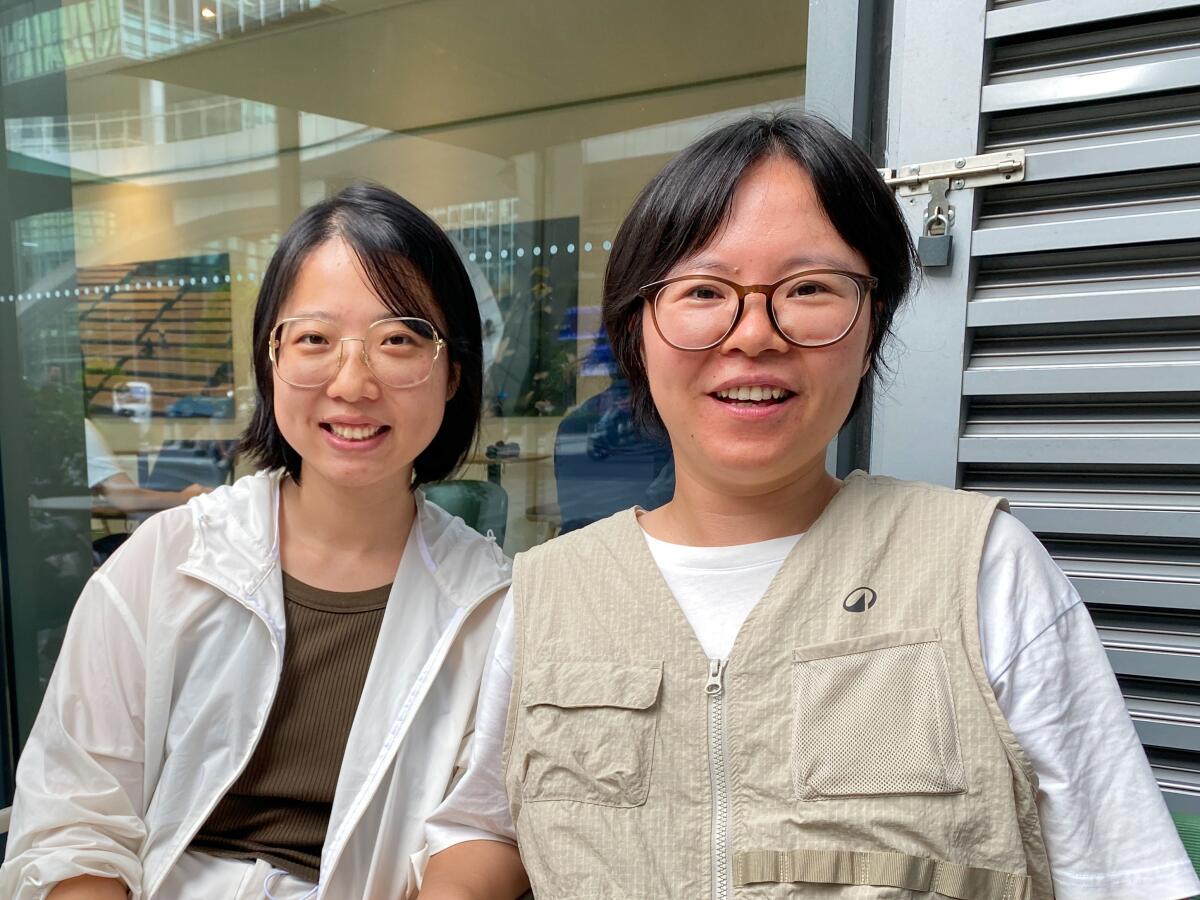 Luno Wang, left, and Hilda Wang are determined to confront folks smoking in public.