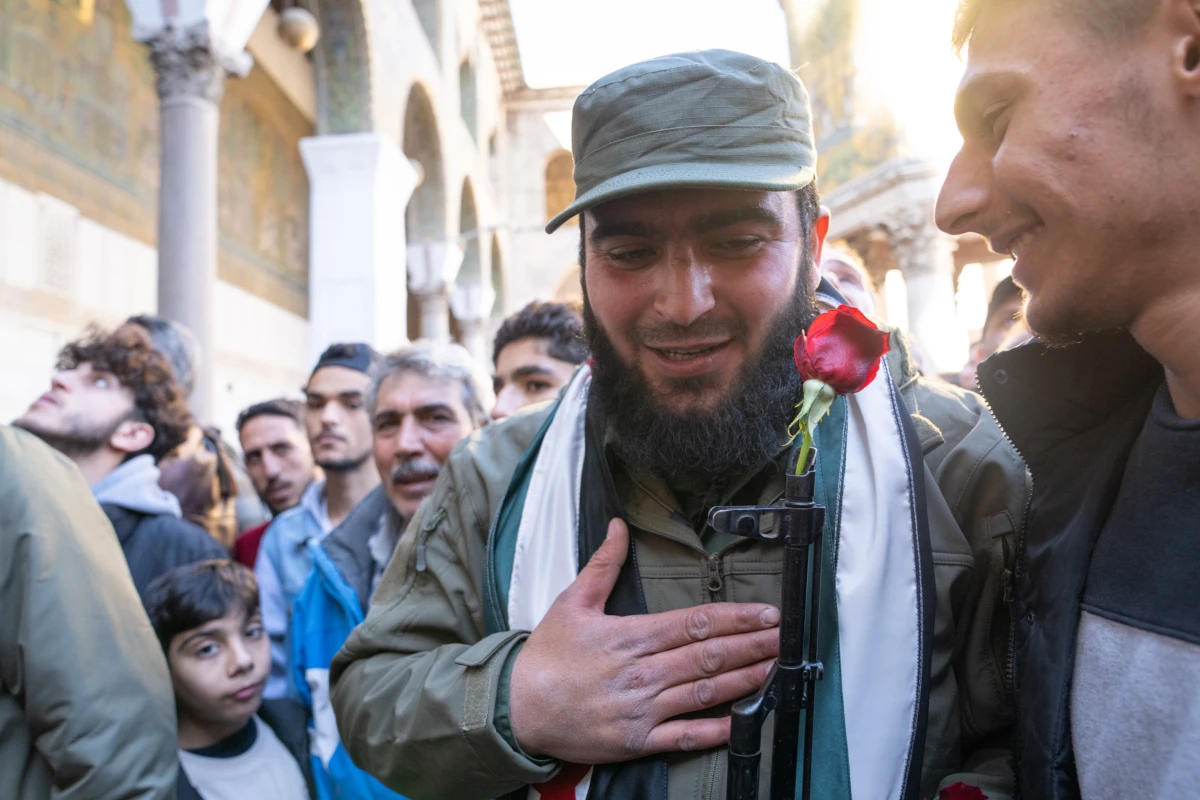 A soldier with a flower in his gun at the Umayyad Mosque in Damascus on Friday.