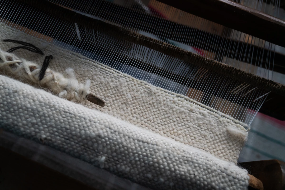 Wool from local sheep is used in making a hunia.