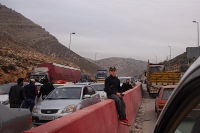 People wait in long lines to enter Lebanon from Syria at the Masnaa border crossing on Dec. 11. Many more than were heading in the other direction. (NPR)