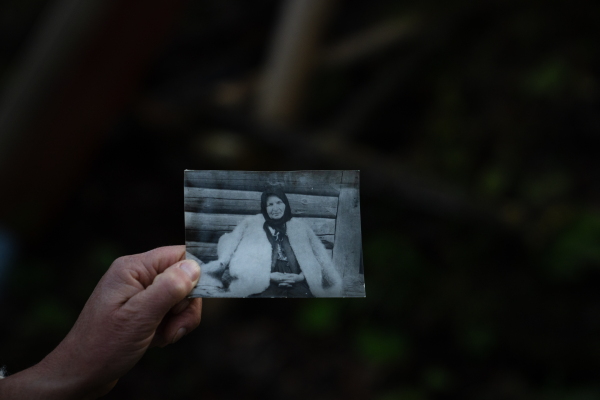 Olha Mys shows a photos of her grandmother wearing a hunia. The tradition of crafting the coats has been in the family for generations.