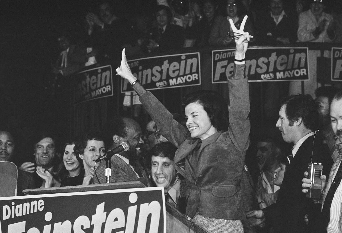 Dianne Feinstein, named mayor following the assassination of late Mayor George Moscone in San Francisco, won the office in her own right beating challenger Quentin Kopp by a large majority on Dec. 12, 1979. With her on the victory platform are, from left, Moscone's widow, Gina Moscone, Assemblyman Willie Brown and Feinstein's fiancé, Richard Blum. Feinstein, who was the first woman to serve as mayor of San Francisco, went on to become the longest-serving member of the U.S. Senate.