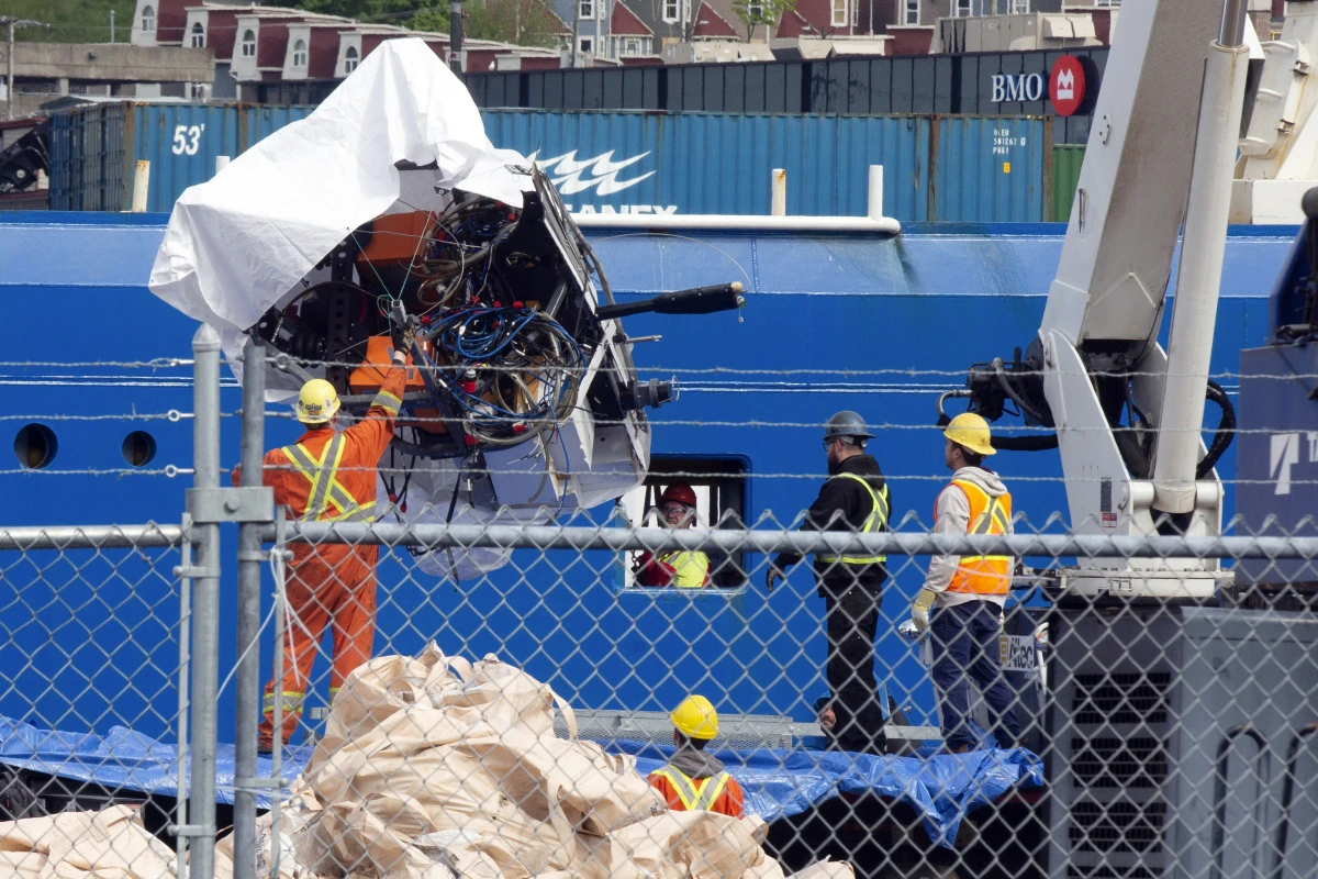 Debris from the Titan submersible, recovered from the ocean floor, is unloaded from the ship Horizon Arctic at the Canadian Coast Guard pier in St. John's, Newfoundland, on June 28, 2023.
