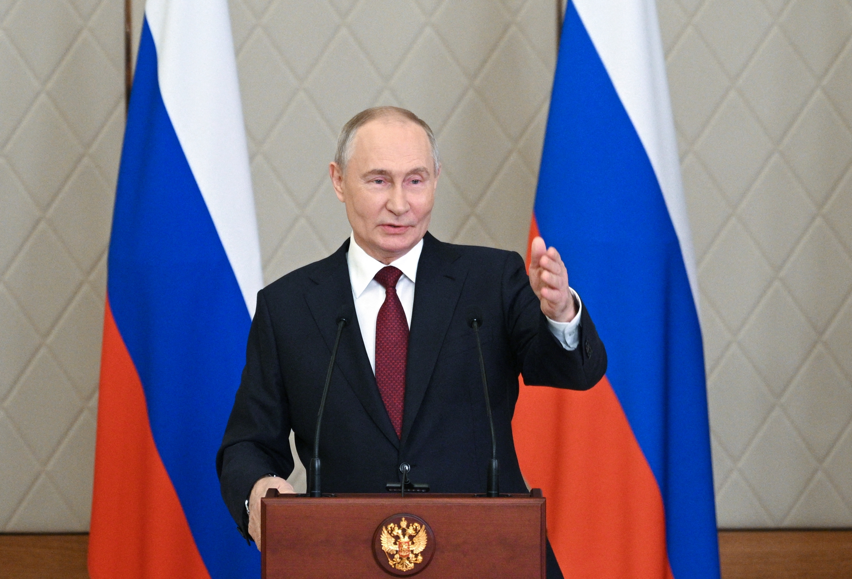 In this pool photograph distributed by the Russian state agency Sputnik, Vladimir Putin talks to the media after attending a meeting of the Collective Security Treaty Organization (CSTO) in Astana on Thursday.