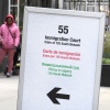 People wait in a cue before being led into a downtown Chicago building where an immigration court presides in November 2024 in Chicago.